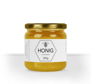 Kleines Etikett "Bienenstolz" auf Honigglas