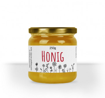 Kleines Etikett "Wiesenfreude" auf Honigglas
