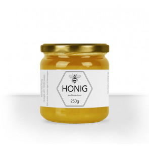 Kleines Etikett "Bienenstolz" auf Honigglas